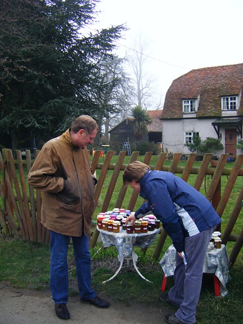 Clare and Sir Andrew Motion inspect the jam for sale