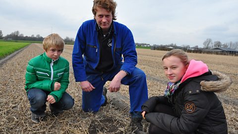 Photo: Ike learns about bulb planting