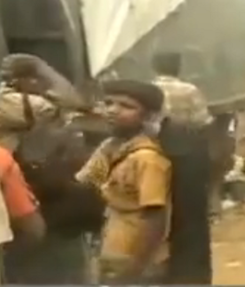 The Boy with the violin, captured on film as he left the battlefield 