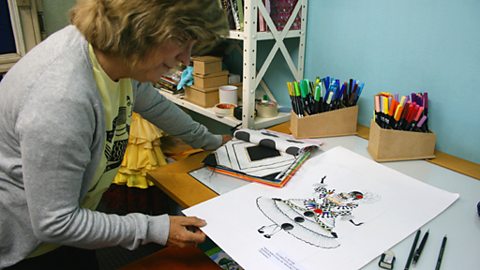Lucy gets a sneak preview of the drawing for the Rocinha carnival display in the 2009 rio carnival