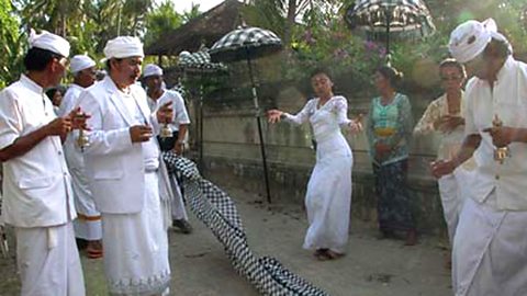 A woman goes into a trance at the dalem ped temple oon nusa penida island