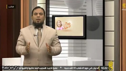 Rabi'ah TV presenter reading out a threat to foreigners
