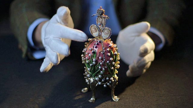 Gloved hands with a Faberge egg
