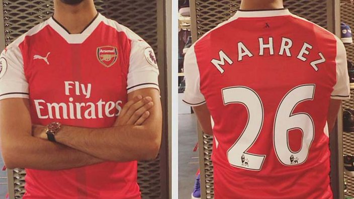 An Arsenal fan with a Riyad Mahrez shirt