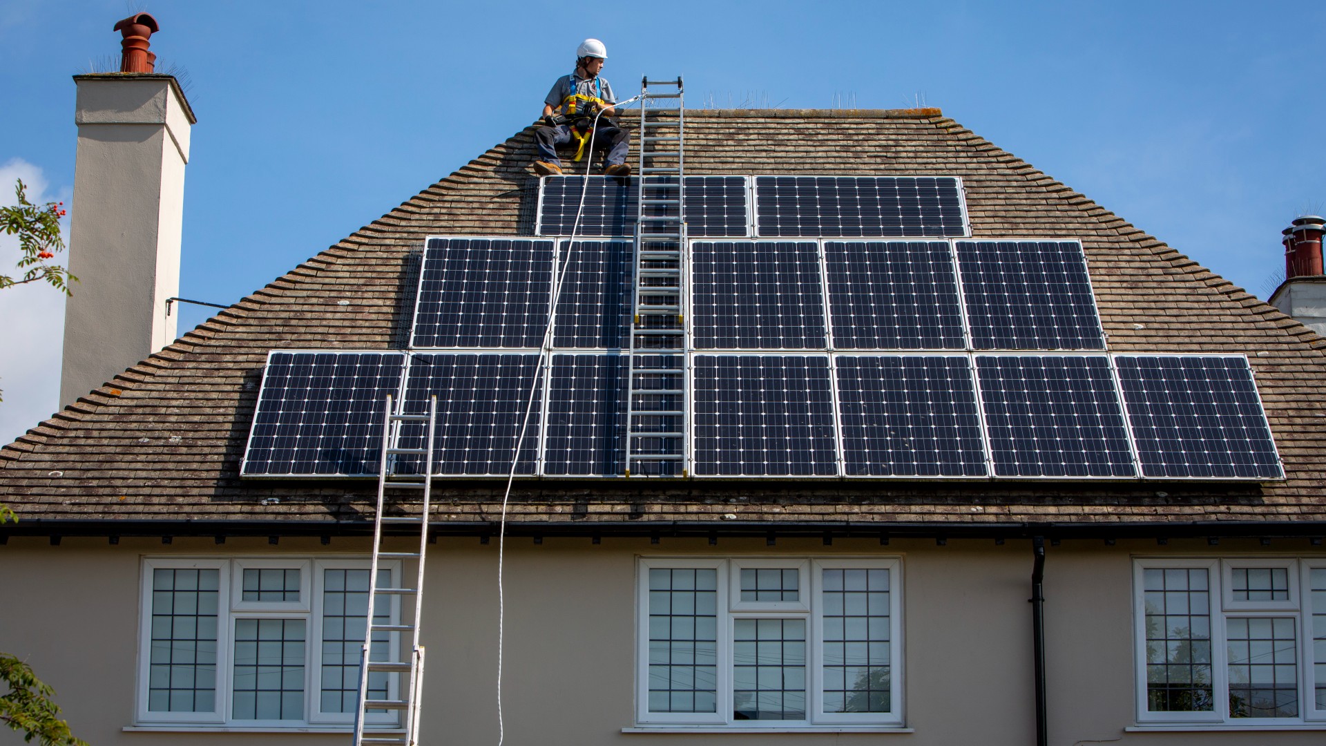 Solar panels being fitted on a roof (Credit: Getty Images)