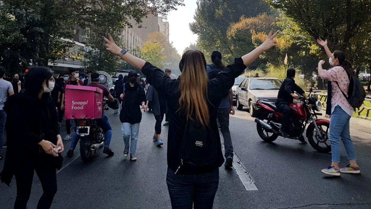 Protesters block a road in Tehran, Iran, on 1 October 2022 (Credit: Rex/Shutterstock)