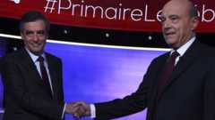 Francois Fillon (left) and Alain Juppe shake hands before their TV debate. Photo: 24 November 2016