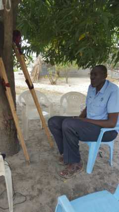 Barka Elias sits on a chair