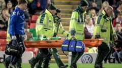 Adam Bogdan is carried off on a stretcher