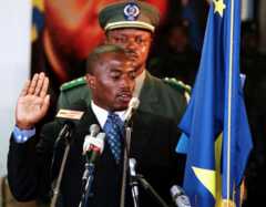 This file photo taken on January 26, 2001 shows General Joseph Kabila taking the oath of office to succeed his slain father as president of the war-wracked and impoverished Democratic Republic of Congo, at the historic Palace of the Nation in Kinshasa.