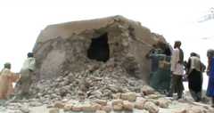 Islamist militants destroying an ancient shrine in Timbuktu in 2012