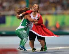 Onye celebrates with Tunisia"s Rima Abdelli