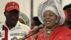 Patience Jonathan standing next to her husband Goodluck in 2015