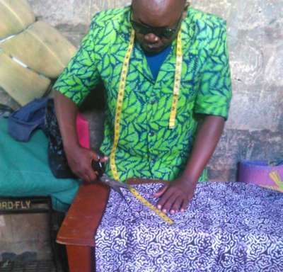 Abdallah Nyangalio making a shirt