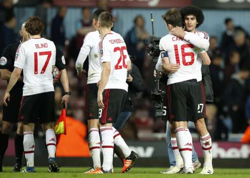 Manchester United's players celebrate at full-time