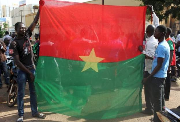 Burkinabe holding flag