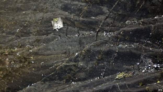 Debris lies on the mountain slopes after the crash of the Germanwings plane over the French Alps