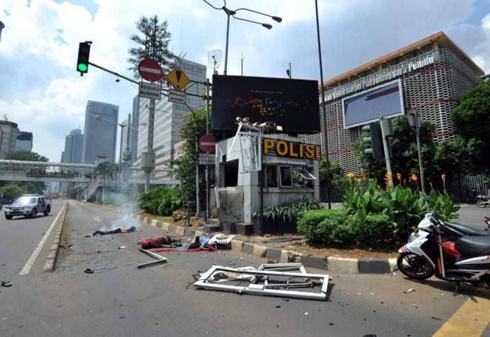 The scene of a bomb blast at a police station in front of a shopping mall in Jakarta
