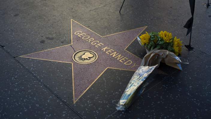 Flowers left on George Kennedy's star on the Hollywood Walk of Fame