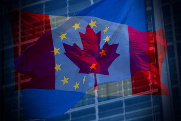 An EU and Canadian flag