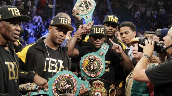 Floyd Mayweather with belts