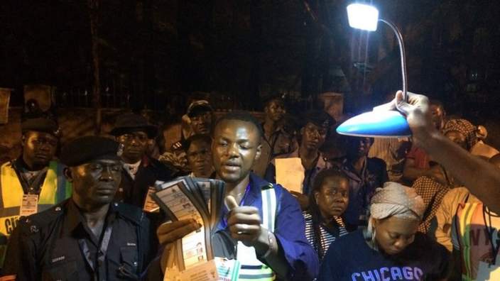 Counting votes by torchlight in Abuja