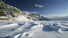 The frozen winter sea ice and cliffs of the Canadian Arctic