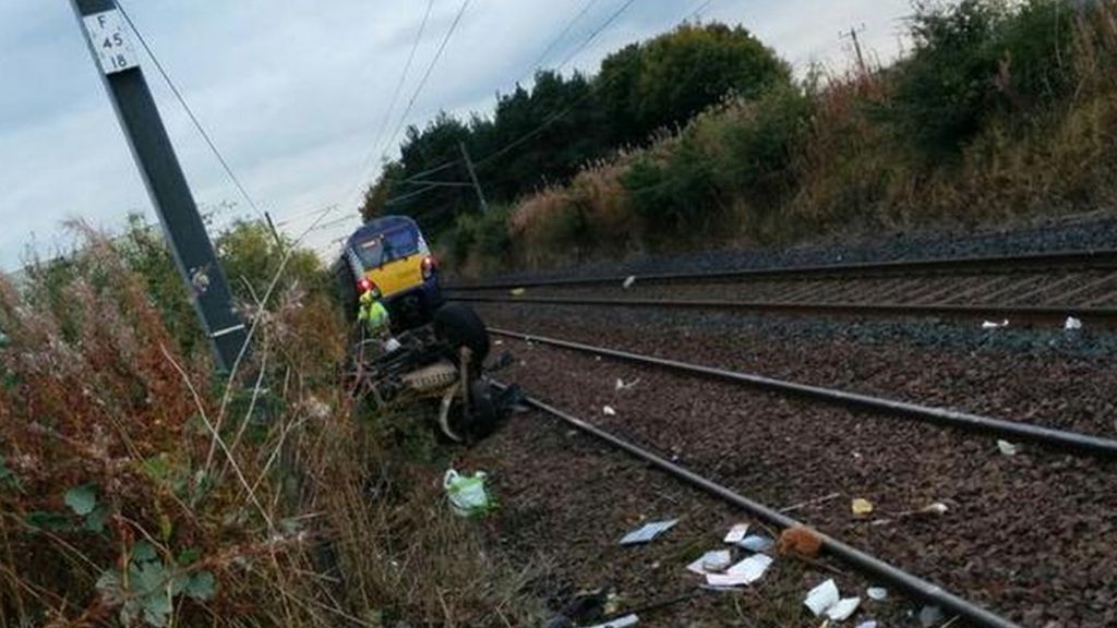 Train hits vehicle on railway line
