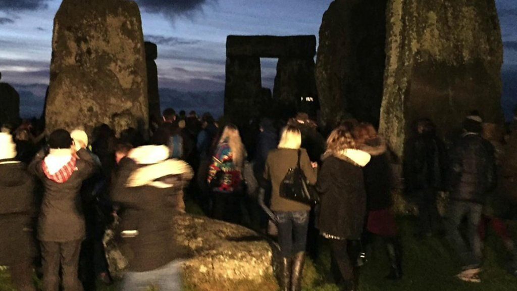 Stonehenge winter solstice celebrated by a crowd of thousands