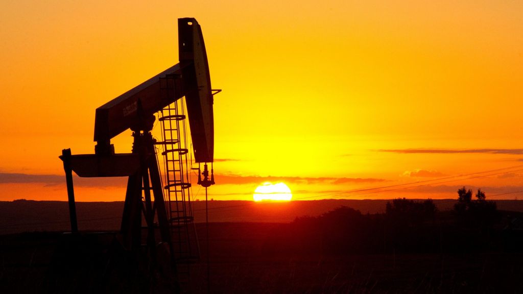 Stock markets sink as oil keeps sliding