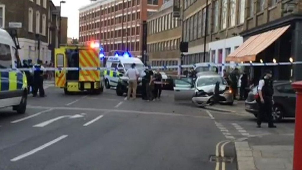 Unmarked police car crashes into London diners