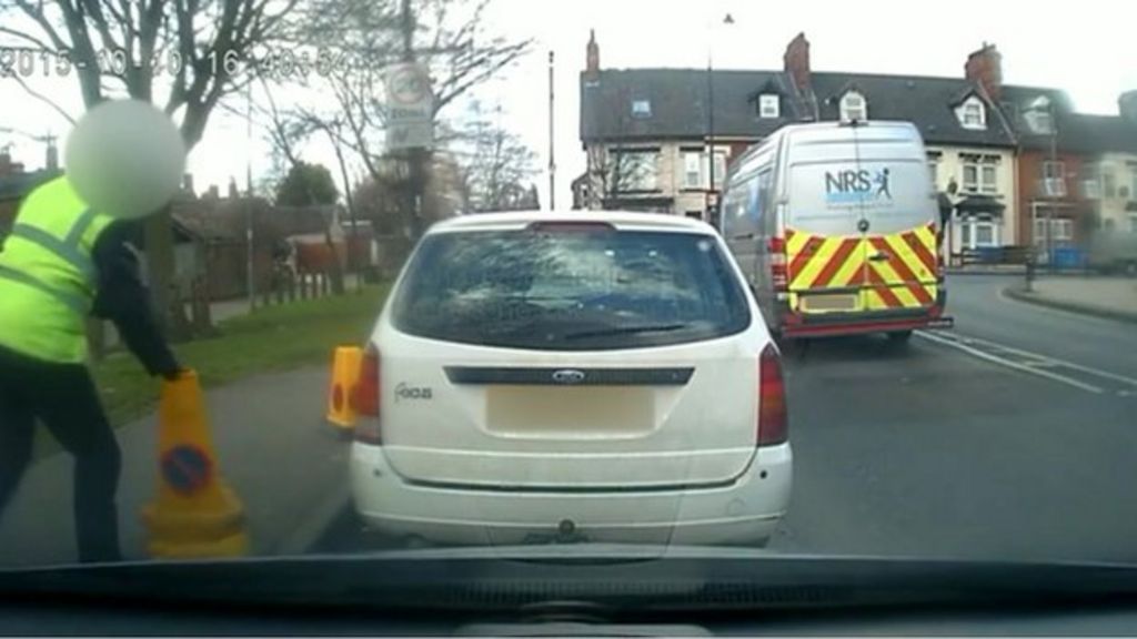 Parking row after warden moves cone