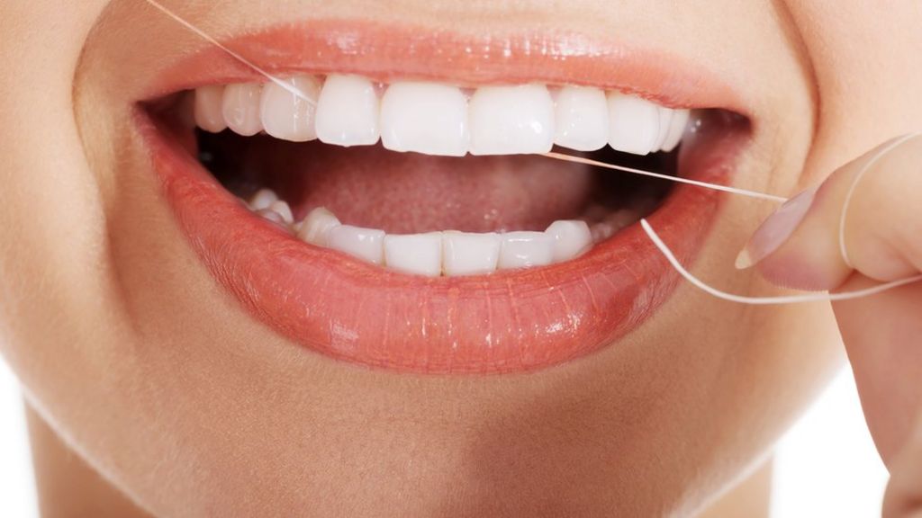 Should you floss or not? Study says benefits unproven - BBC News