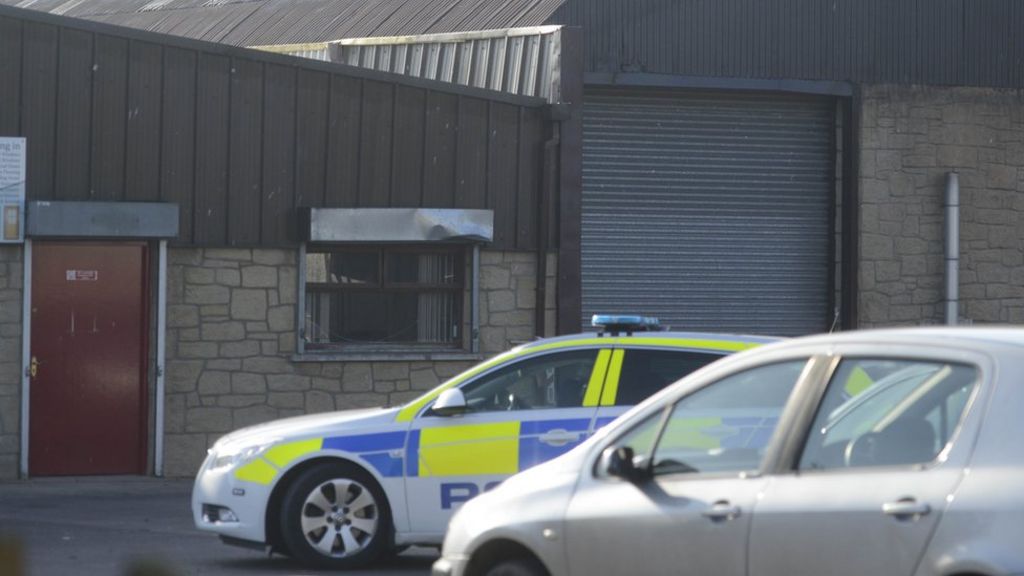 Man charged with body in garage murder