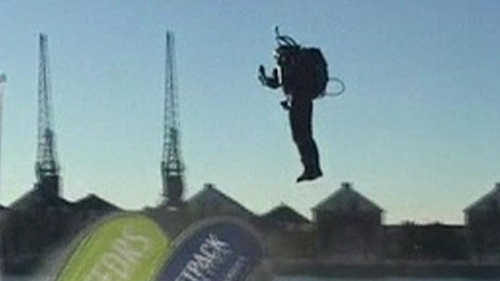 Jetpack pilot in flight across Royal Docks