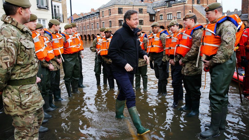 Cameron defends UK flood investment