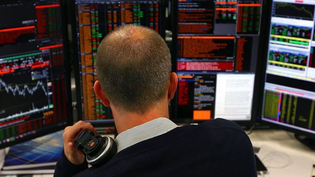 FTSE 100 rises but Next shares hit by profit dip