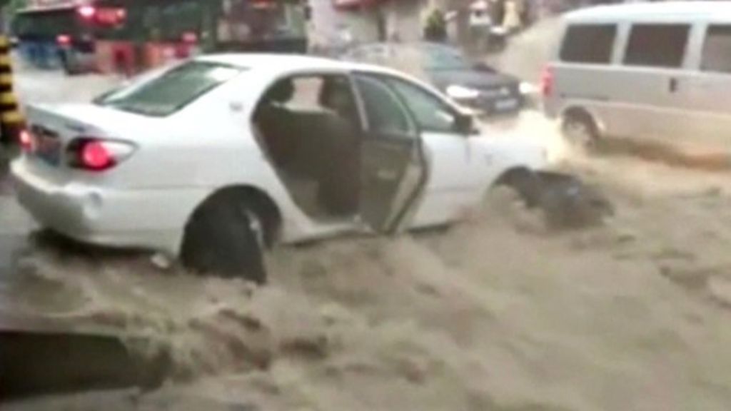Cars swept down streets in Chinese city