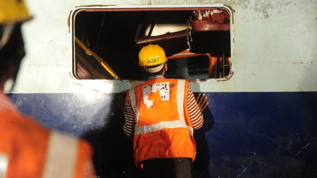 India train: Rescuers comb through mangled wreckage