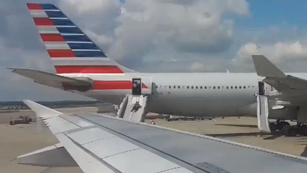 Passengers evacuate from American Airlines plane at Heathrow over 'smoke'