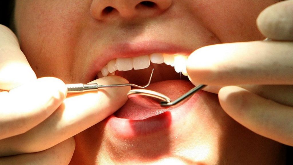 Woman 'may lose teeth' after Grimsby dental practice error