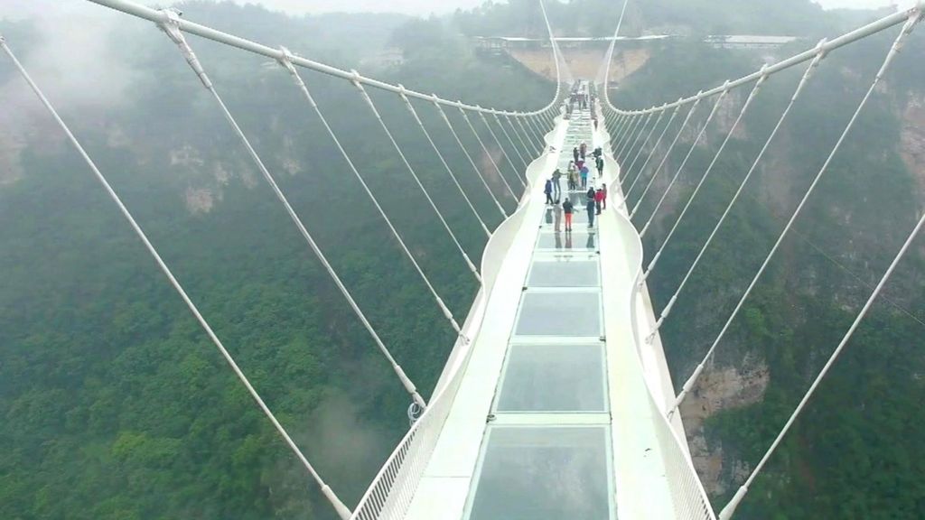 China's giant glass bridge hit with sledgehammer