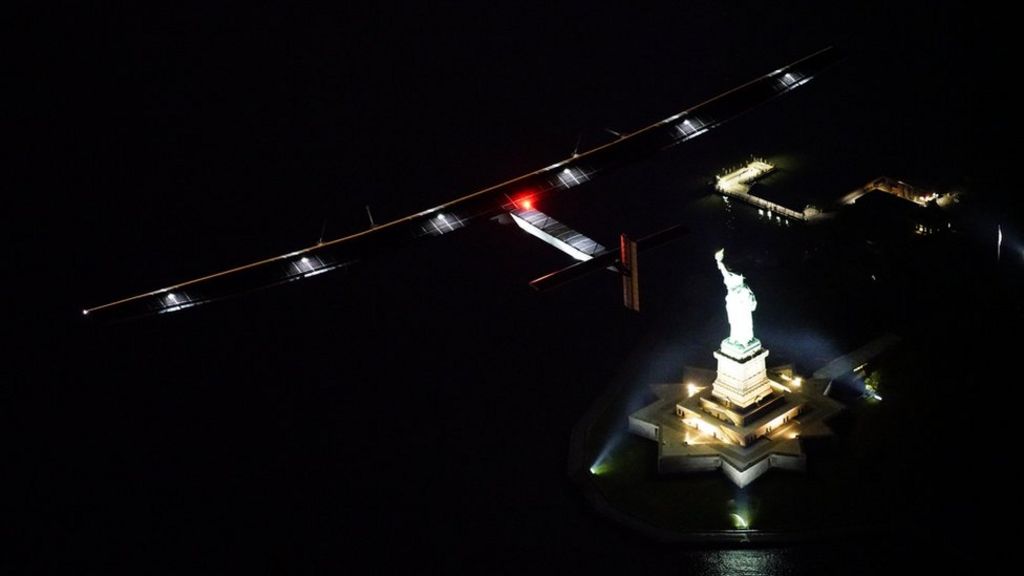 Solar Impulse flies over night-time New York