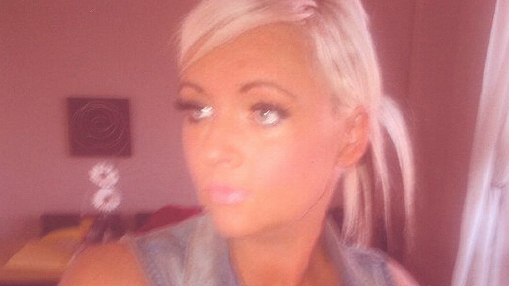 Masked men shot woman 'by mistake'