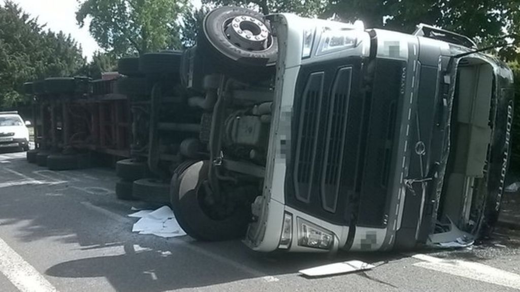 Driver rescued after lorry overturns