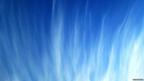 Wispy clouds in a blue sky