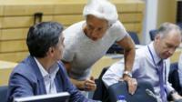 IMF's Christine Lagarde speaks to Greek Finance Minister Euclid Tsakalotos in Brussels on 11 July 2015