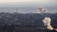 Smoke rises from a village controlled by Islamist rebels in western Syria (11 September)