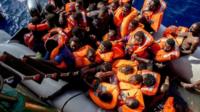 Rescued migrants board a ship during an operation co-ordinated Medecins Sans Frontiers in the Mediterranean Sea. Photo: 26 October 2016