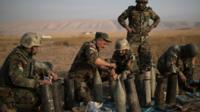 Kurdish Peshmerga fighters prepare to fire artillery at IS positions in Bashiqa, east of Mosul, Iraq (7 November 2016)